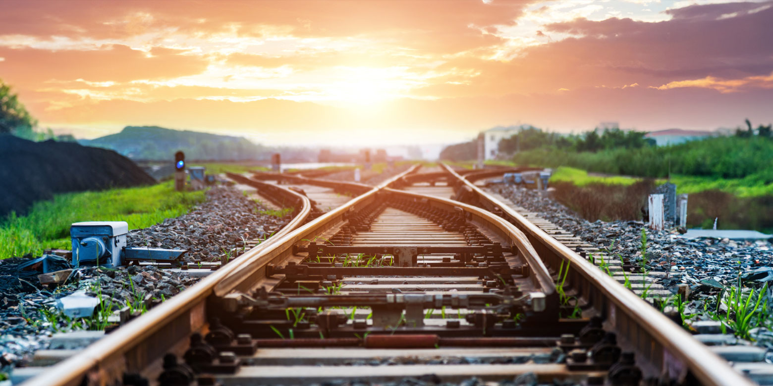 Railroad intersection at sunset