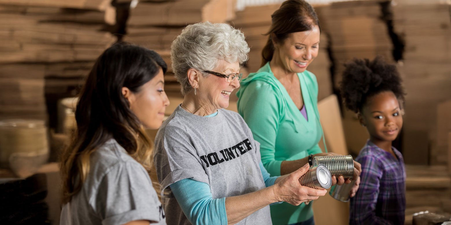 Volunteers sorting canned goods