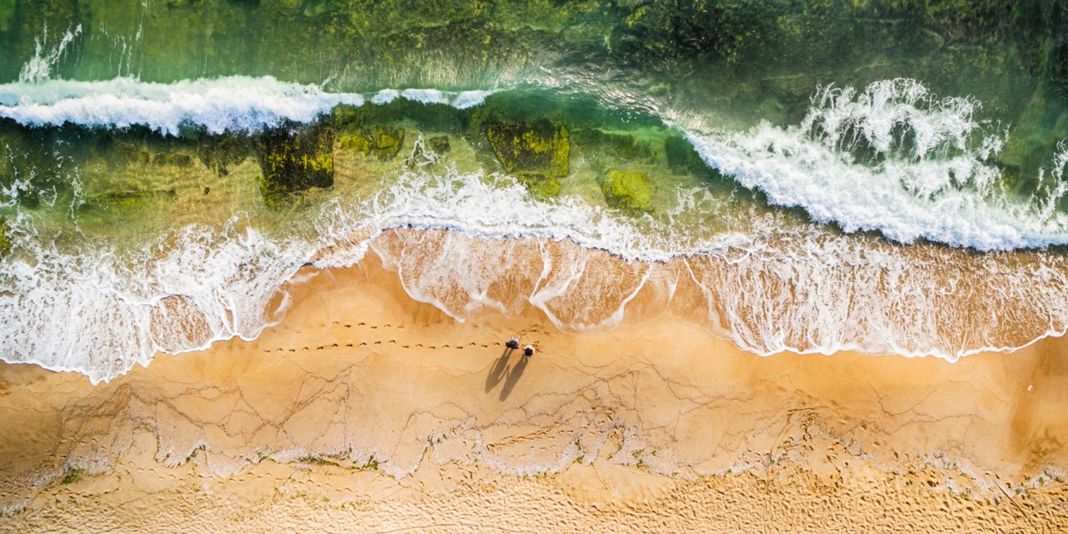 Aerial view of couple on a beach