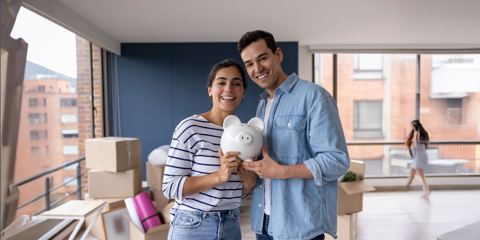 Couple holding a piggy bank