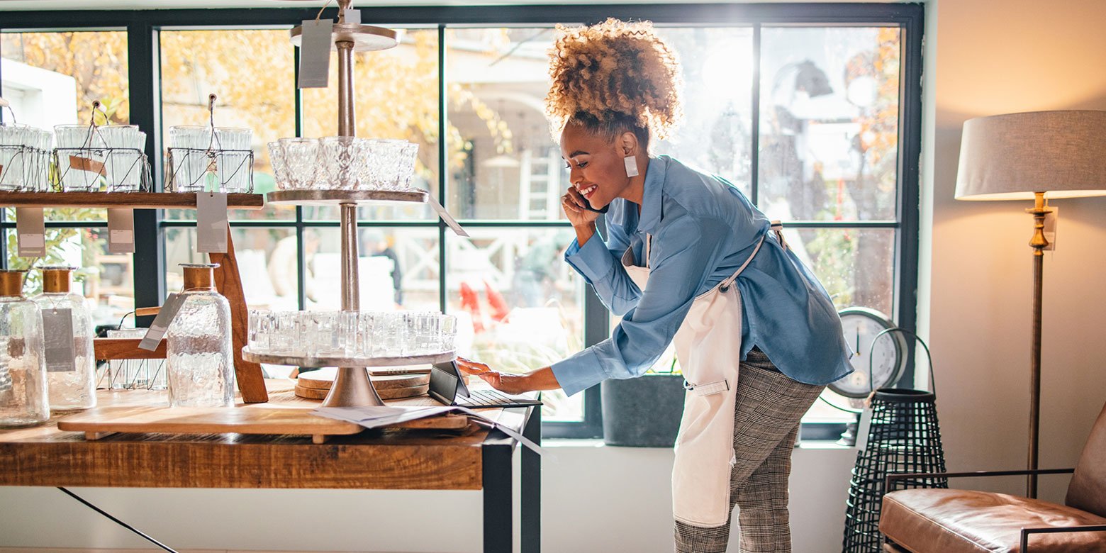 Small business owner on the phone and on the computer
