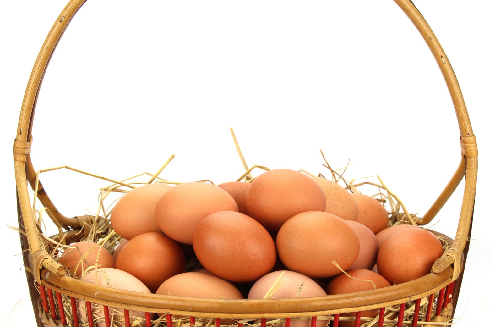 Brown eggs nestled in a wicker basket